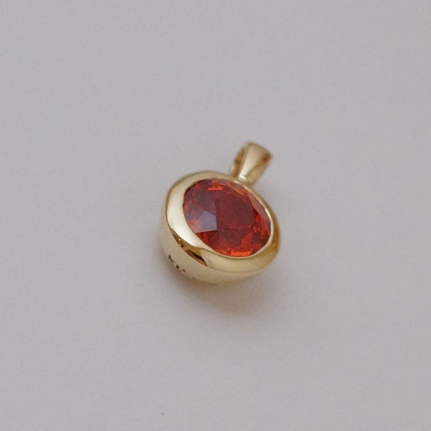 Reddish Orange Sapphire Pendant in Bezel setting